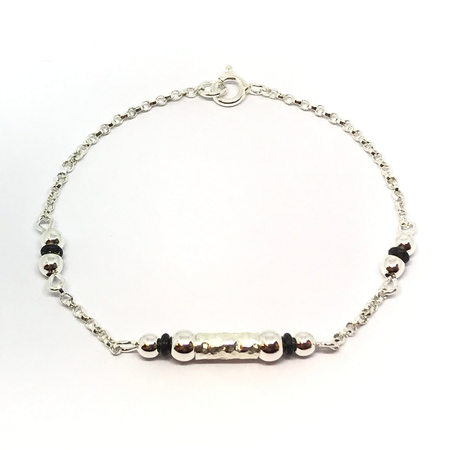Pulsera combinada con caucho y bolitas