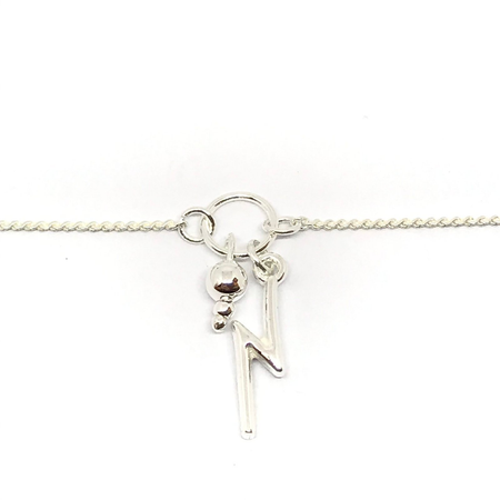 Pulsera con bolita y rayo colgantes