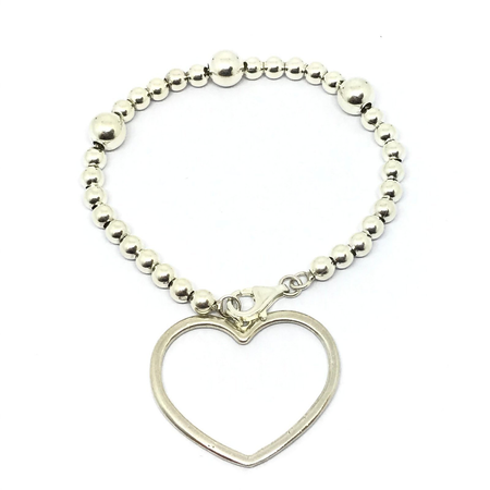 Pulsera con bolitas y corazon colgante