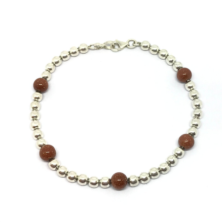 Pulsera con bolitas y brillos