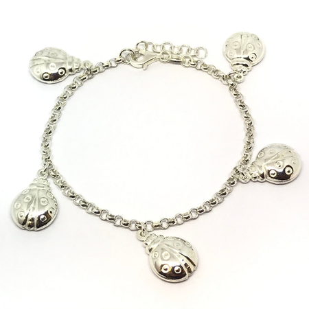 Pulsera rolo con vaquitas de San Antonio colgantes