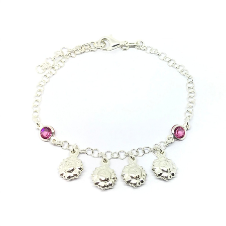Pulsera con cubic y soles colgantes