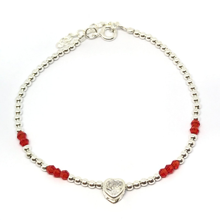 Pulsera con cristales y bolitas combinadas con centro corazon cubic